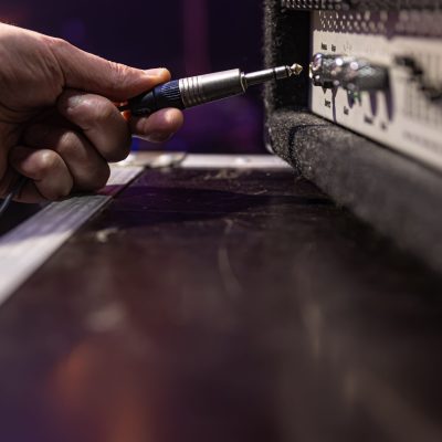 Jack audio connector being plugged into a socket on an audio device for music, audio.